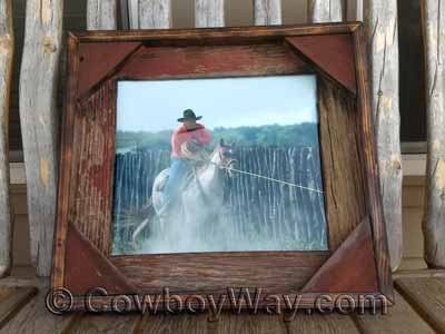 A barn wood picture frame with faded red wood