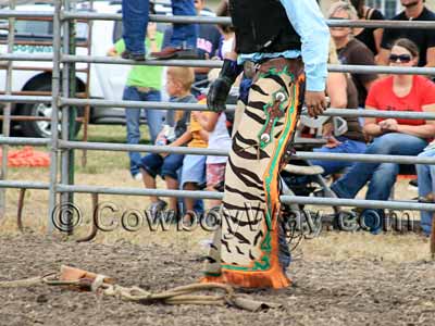 A cowboy wearing rodeo chaps