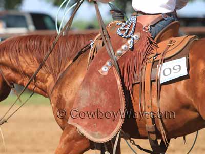 Batwing chaps on a working cowboy