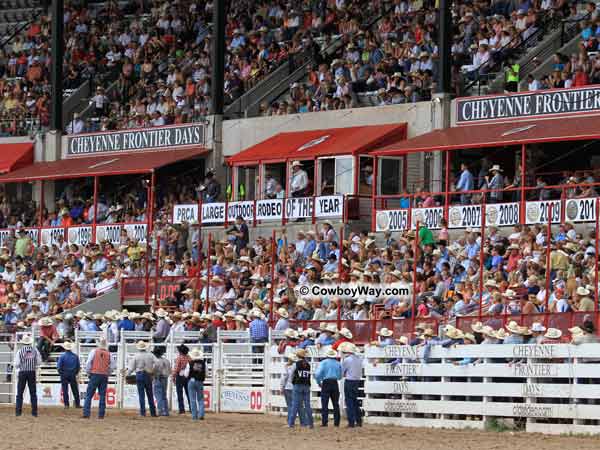 The crowd at the Cheyenne Frontier Days Rodeo watches the bull riding The crowd at the Cheyenne Frontier Days Rodeo watches the bull riding