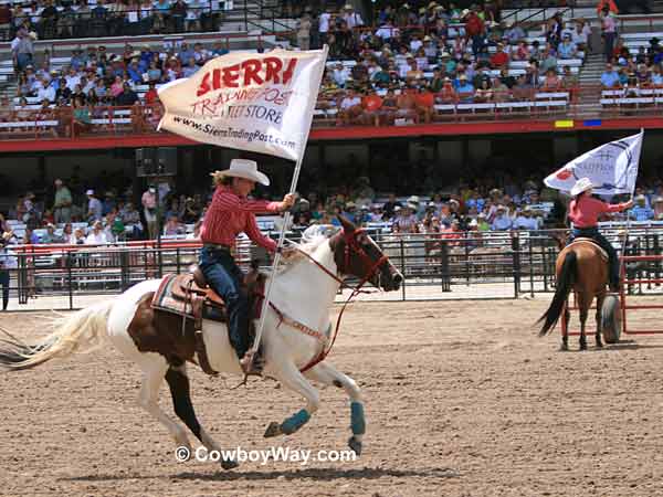 The Cheyenne Dandies presenting 
sponsor flags