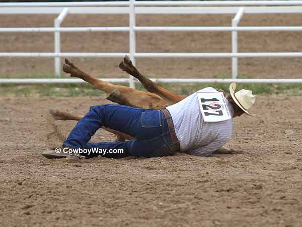 Steer wrestler Seth Brockman completes a successful run