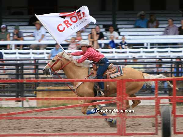 A Cheyenne Dandie carries a sponsor flag A Cheyenne Dandie carries a sponsor flag