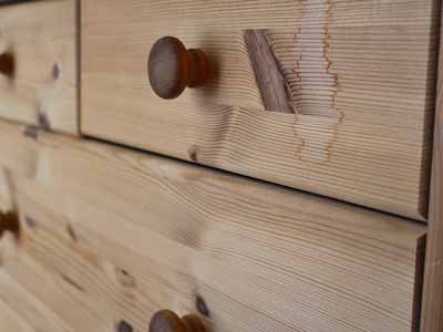 A wooden cabinet knob