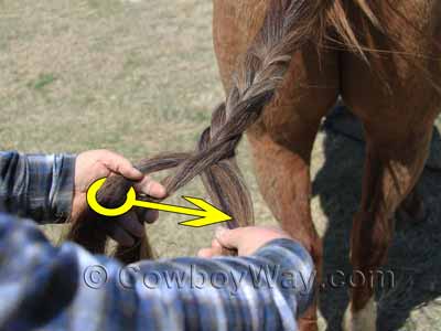 The fishtail braid begins to take shape