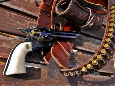 A leather gun belt, holster, and revolver