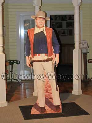 A John Wayne (with rifle) cardboard cutout