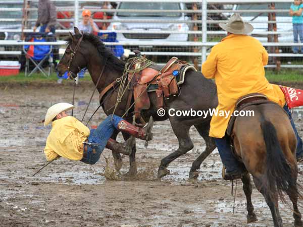 A ranch rodeo contestant hangs up in his rope