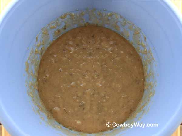 Bananas, brown sugar, butter, eggs, and vanilla The mixed wet banana bread ingredients