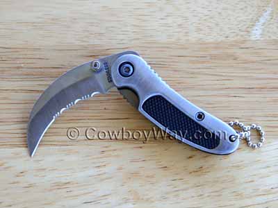 Serrated clip knife with a partially smooth blade