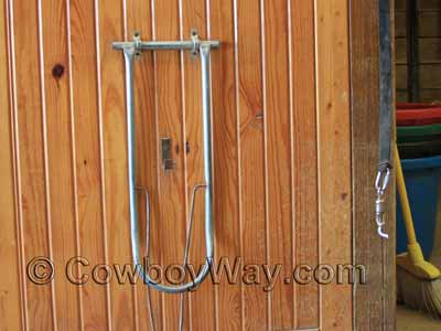 A collapsed wall mounted saddle rack