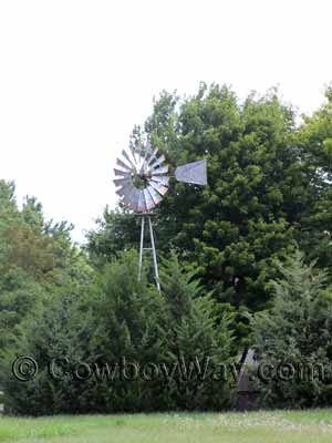 A windmill surrounded by trees