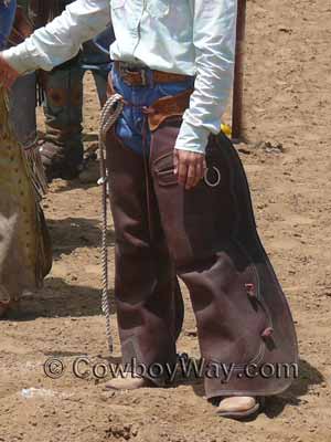 A woman wearing bating chaps