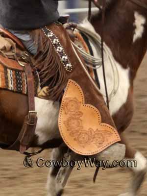 A pair of batwing chaps with fringe