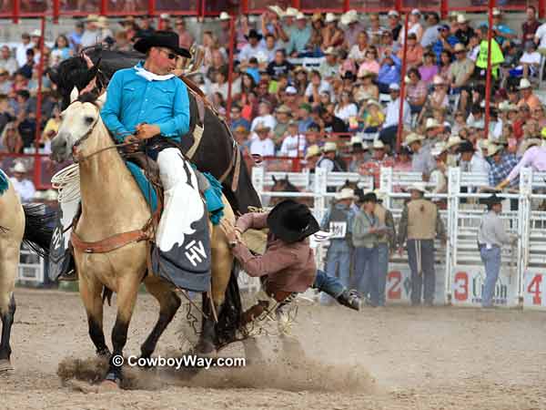 Saddle bronc rider misses the 
pick up horse