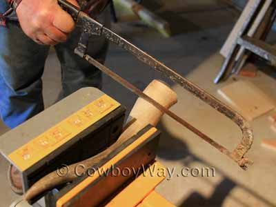 Sawing off the base of the horn
