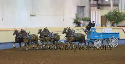 A six horse team pulling a horse drawn wagon