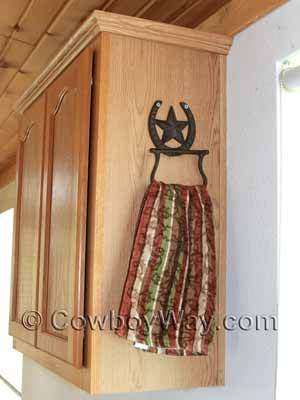 A decorative, horseshoe towel holder