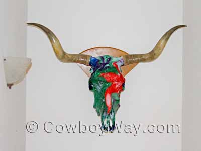 A cow skull that has been painted by hydro dipping