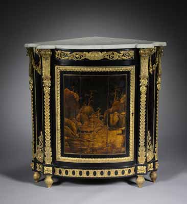 A very ornate corner cabinet