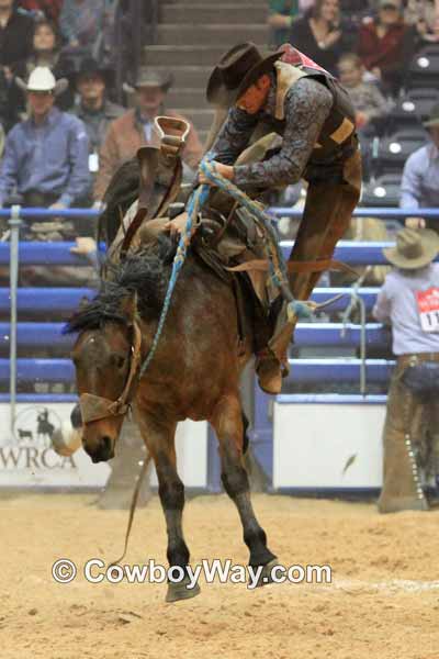 A ranch bronc rider coming off the bronc