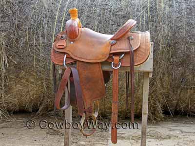 A used custom made ranch saddle