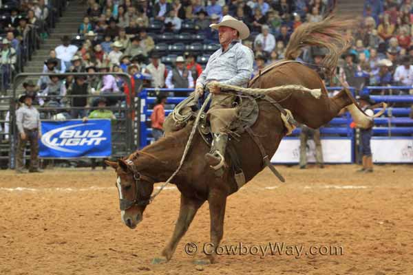Bruce Beeman, Kansas, rides a ranch bronc at the WCRR in Amarillo, TX