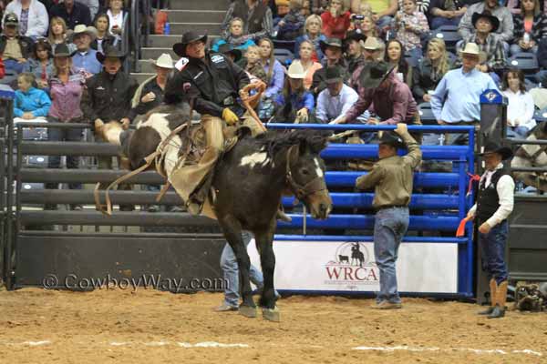 Jake Mitchell from the Crutch Ranch in Texas on rides a ranch bronc