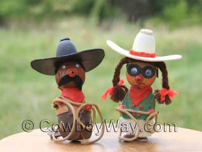 Bride and groom cowboy wedding cake toppers