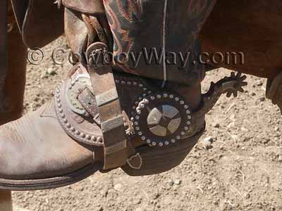 Western spurs on a working cowboy