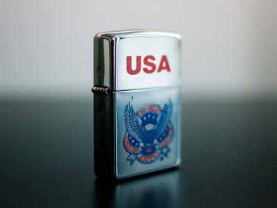 A red, white, and blue Zippo lighter